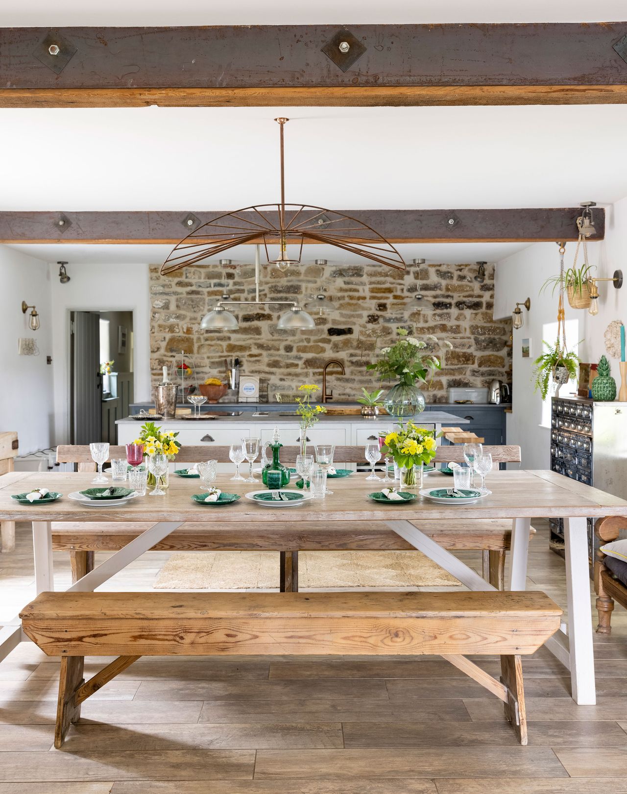 dining room in open plan space with kitchen behind