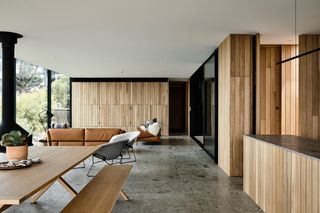 Living space with wooden bench table and brown sofa