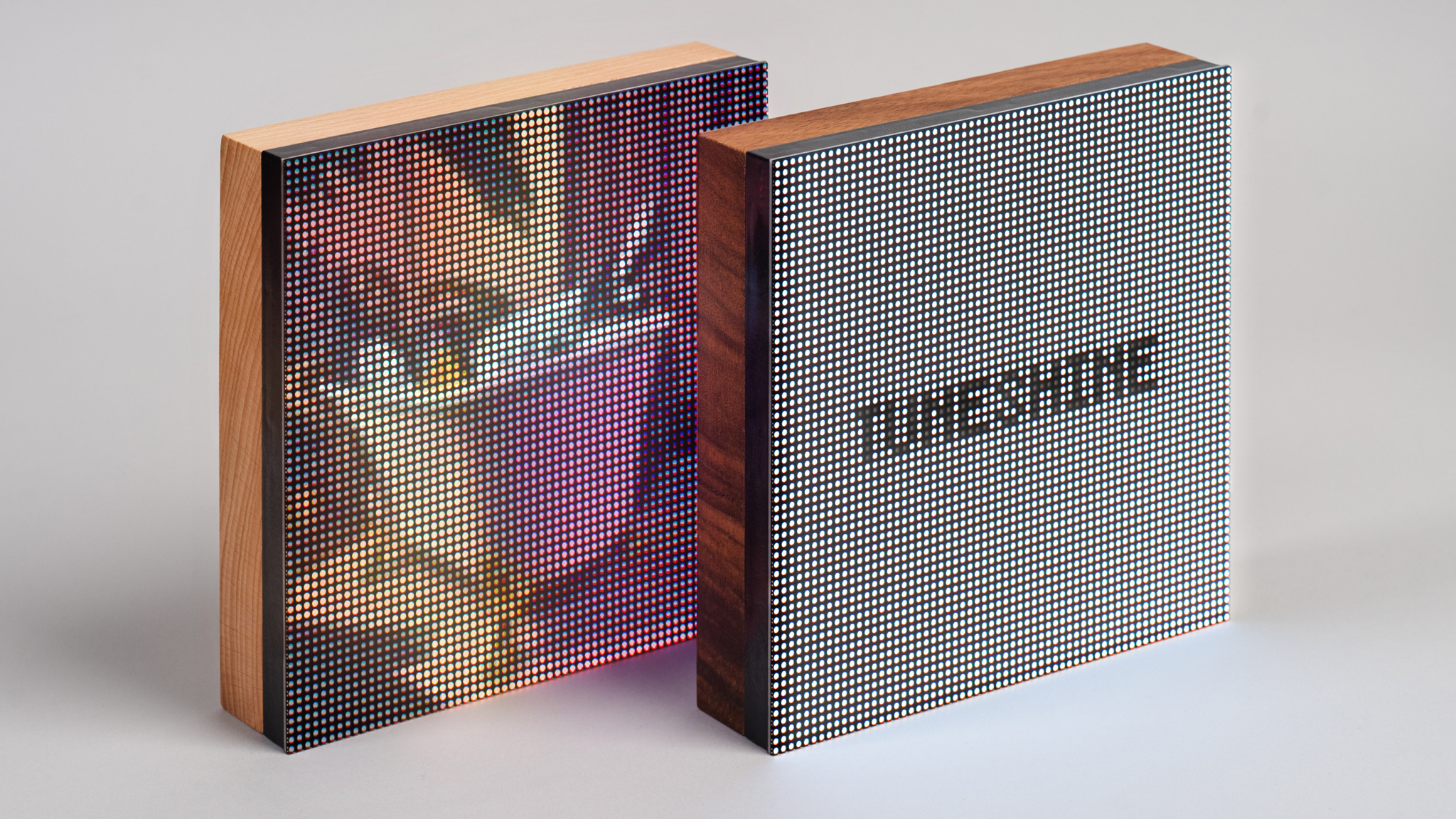 The Tuneshine LED album art display on a light background: two displays, one with an album and the other with the Tuneshine logo on it