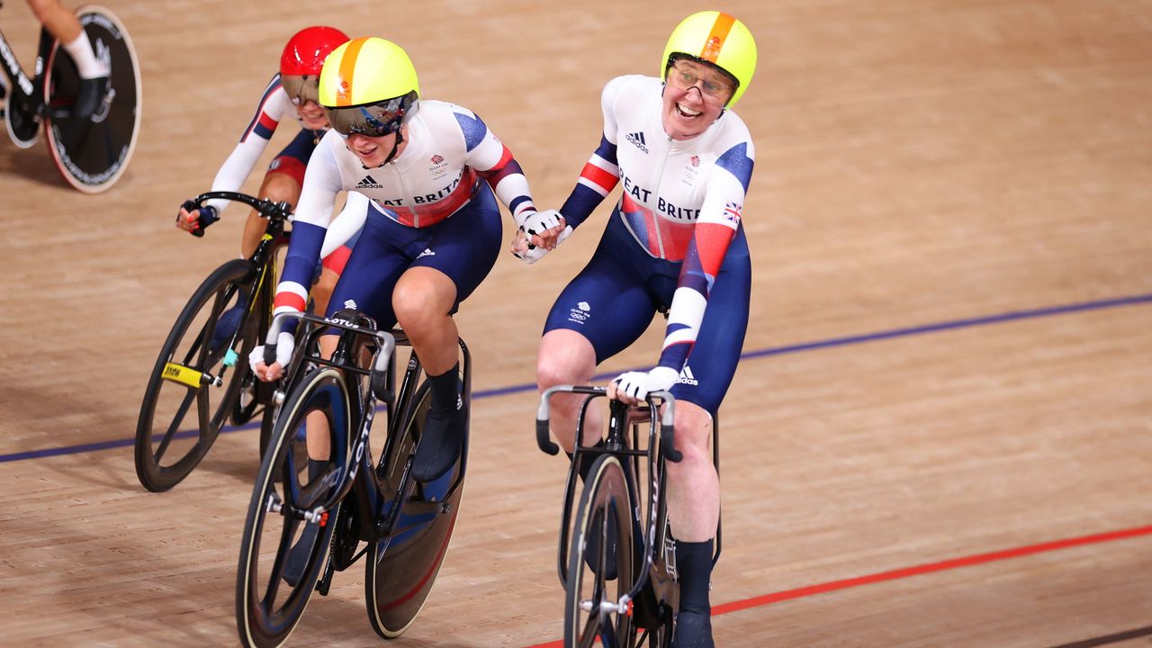 Laura Kenny and Katie Archibald of Team Great Britain celebrate winning a gold medal during the Women&#039;s Madison final of the track cycling on day fourteen of the Tokyo 2020 Olympic Games