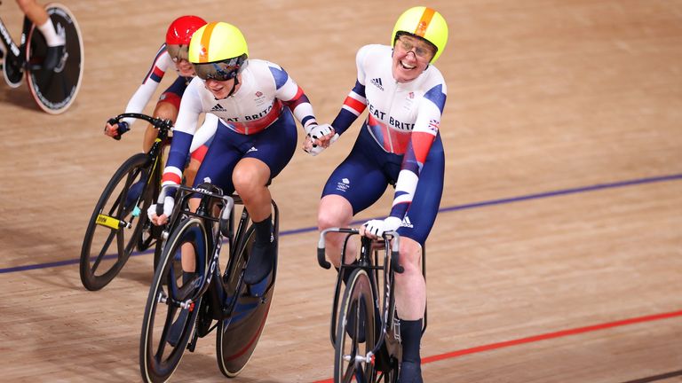Laura Kenny and Katie Archibald of Team Great Britain celebrate winning a gold medal during the Women's Madison final of the track cycling on day fourteen of the Tokyo 2020 Olympic Games