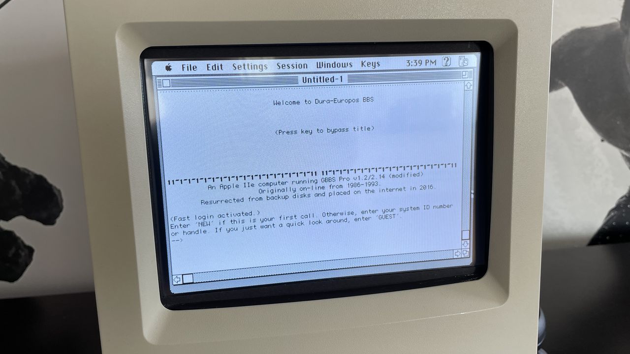 A Macintosh Classic II screen running Dura-Europas, an Apple II e-based BBS that was resurrected from backup disks in 2016