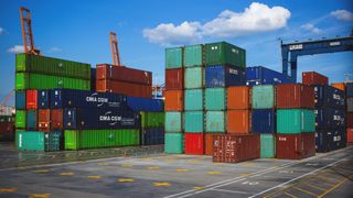 Shipping containers sitting in a port