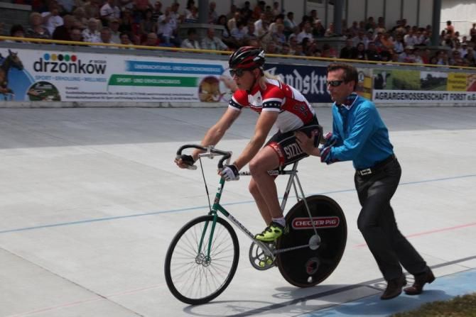 Zak Kovalcik gets a push off from former steher world champion Carsten Podlesch.