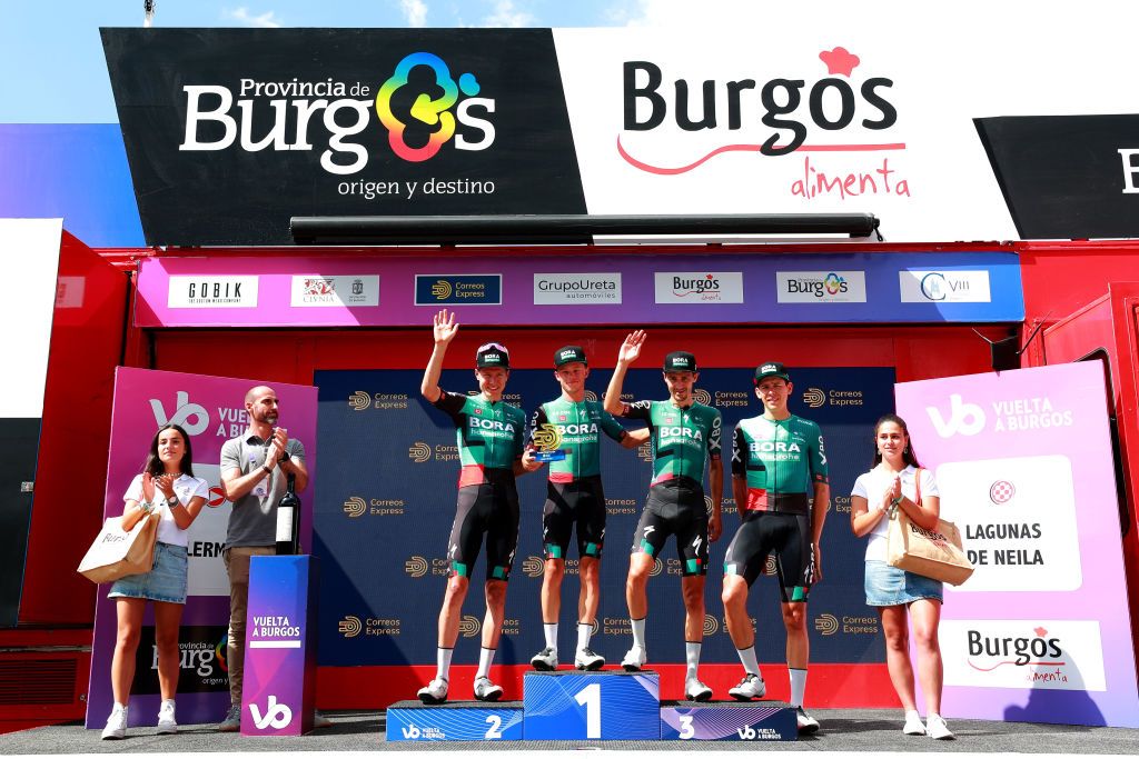 NEILA SPAIN AUGUST 06 LR Wilco Kelderman of Netherlands Matteo Fabbro of Italy Emanuel Buchmann of Germany and Patrick Gamper of Austria and Team Bora Hansgrohe celebrates winning the best team on the podium ceremony after the 44th Vuelta a Burgos 2022 Stage 5 a 170km stage from Lerma to Lagunas de Neila 1867m VueltaBurgos on August 06 2022 in Neila Spain Photo by Gonzalo Arroyo MorenoGetty Images