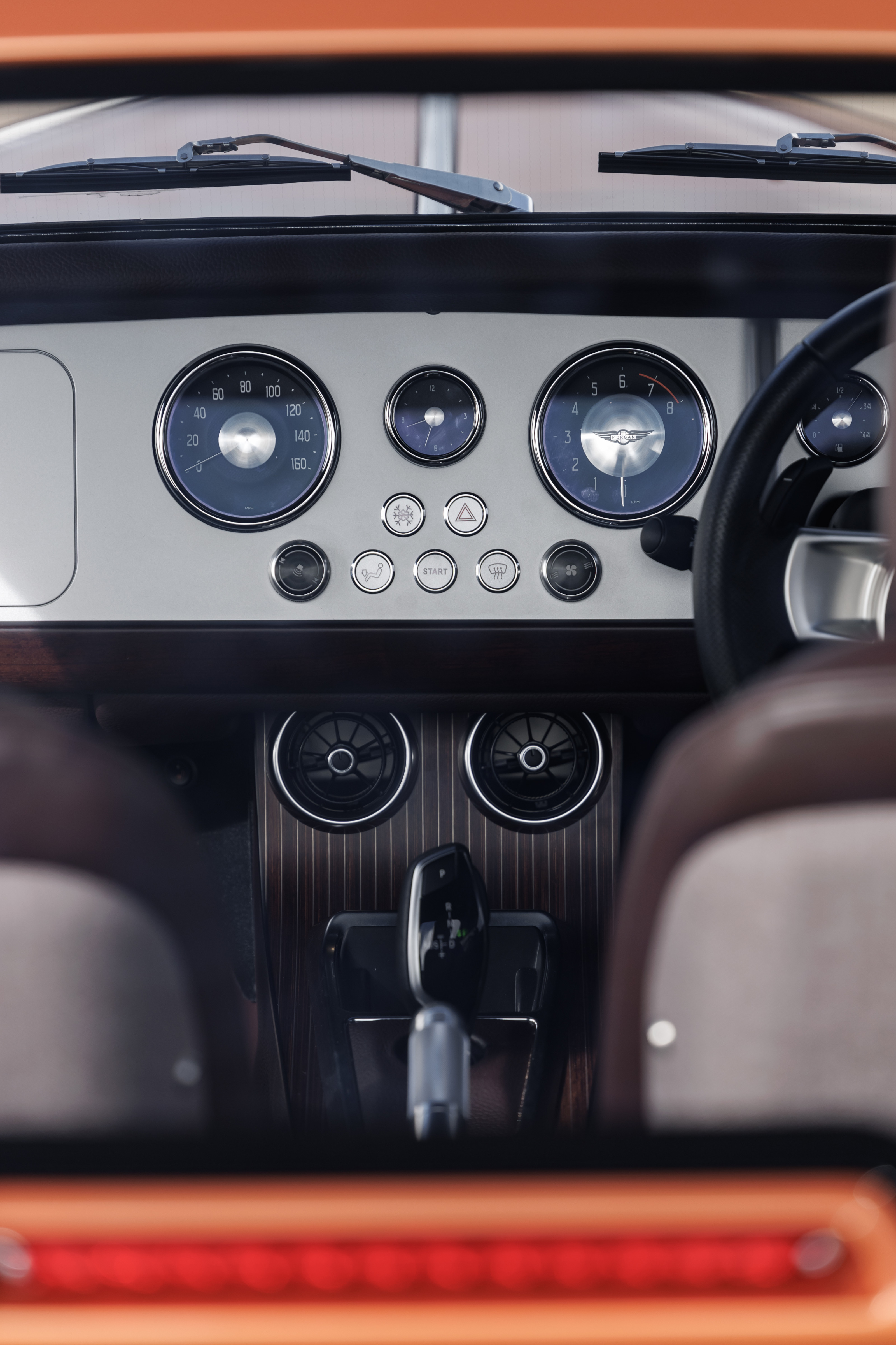 Traditional dials are paired with a simple screen behind the steering wheel