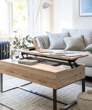 Next coffee table with raised desk and storage features