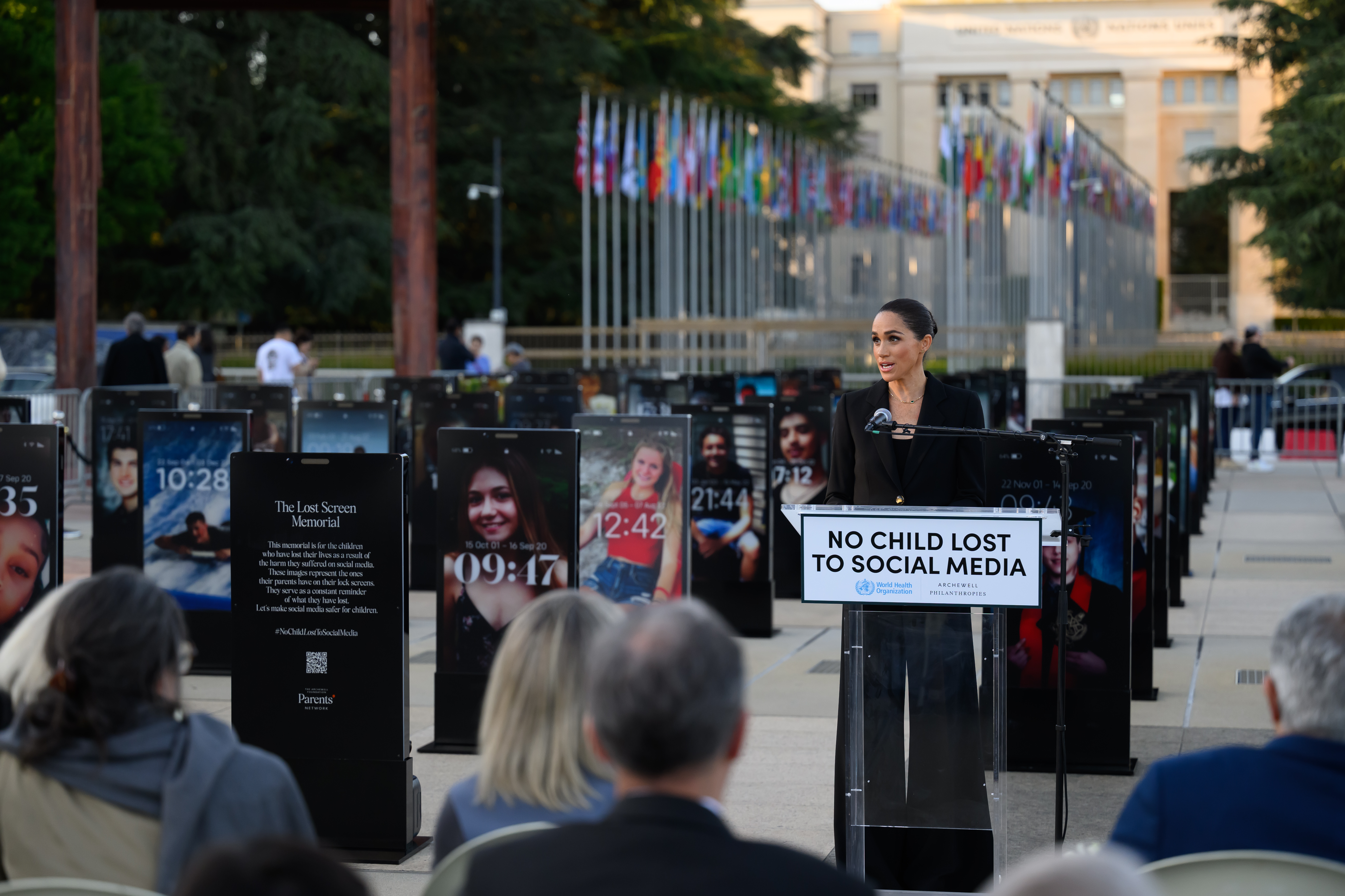 Meghan Markle speaking at a podium at the Lost Screen Memorial