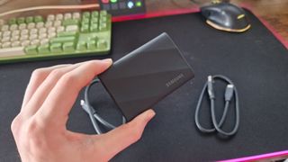 Samsung T9 being held by a reviewer