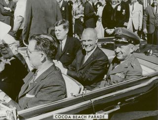 President John F. Kennedy (left), John Glenn and General Leighton I. Davis ride together during a parade in Cocoa Beach, Florida after Glenn's historic first U.S. human orbital spacefight.