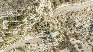Jaguar F-Type 75 seen from above on mountain road