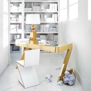 office with white walls and golden desk
