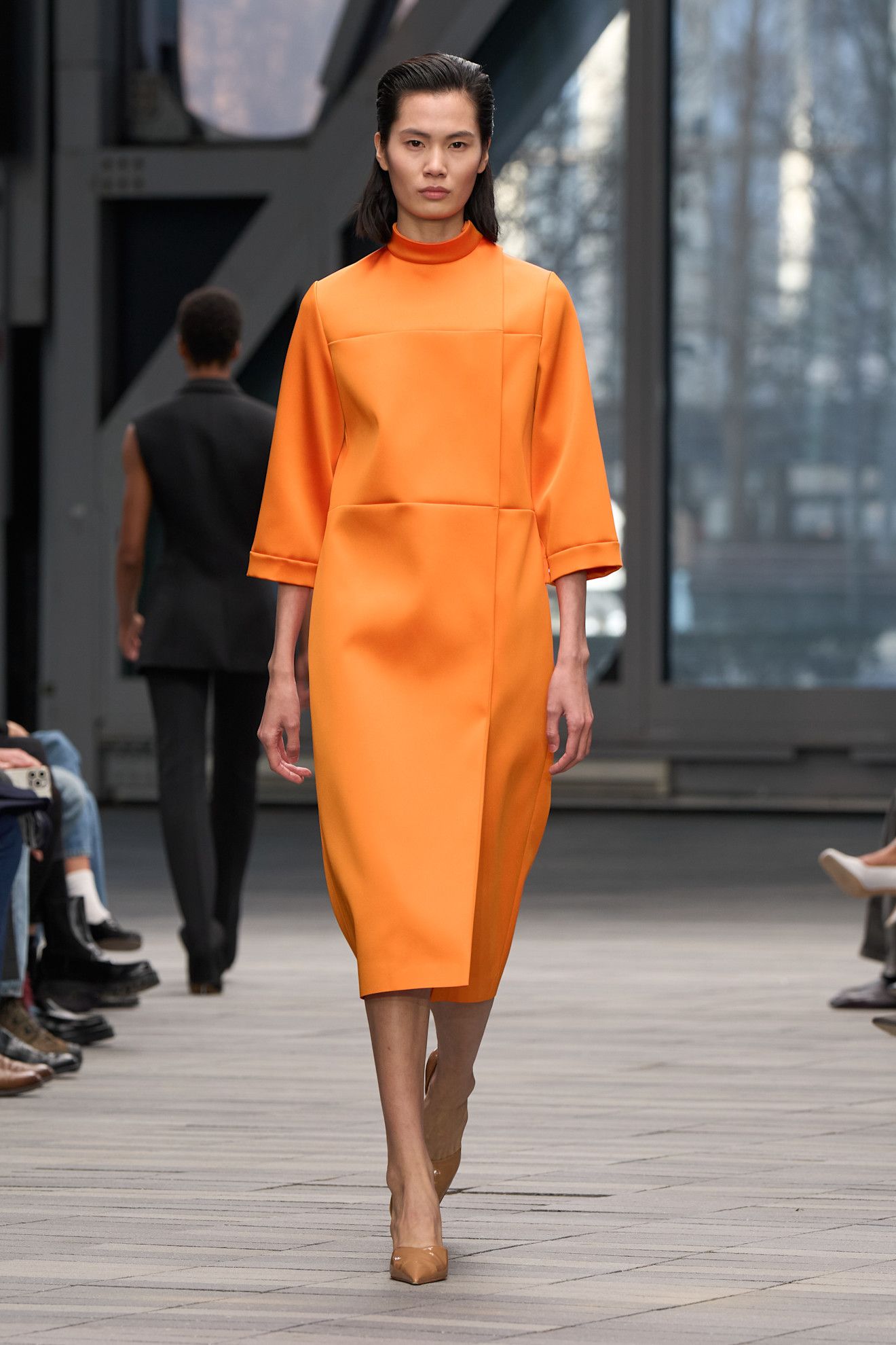 A model wore an orange dress with camel pumps on Calvin Klein's Fall 2026 runway