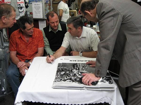 Tales told, autographs written, photos taken