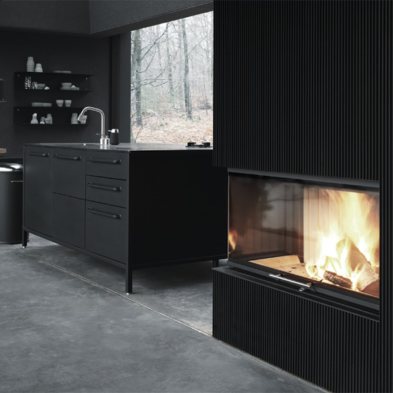 walls covered in a mottled black black shelve and black drawer