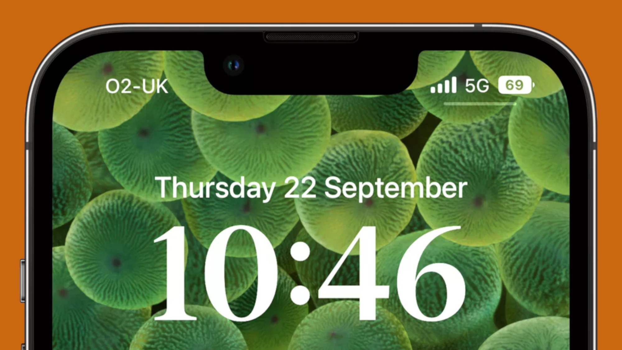 iPhone lock screen on orange background
