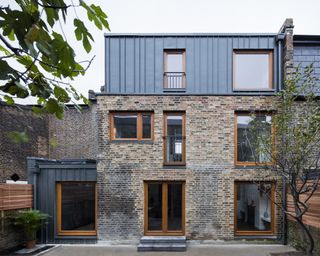 Exterior of Victorian brick house with mansard loft conversion