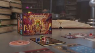 Gloomhaven: Buttons & Bugs box on a table, with the components laid out
