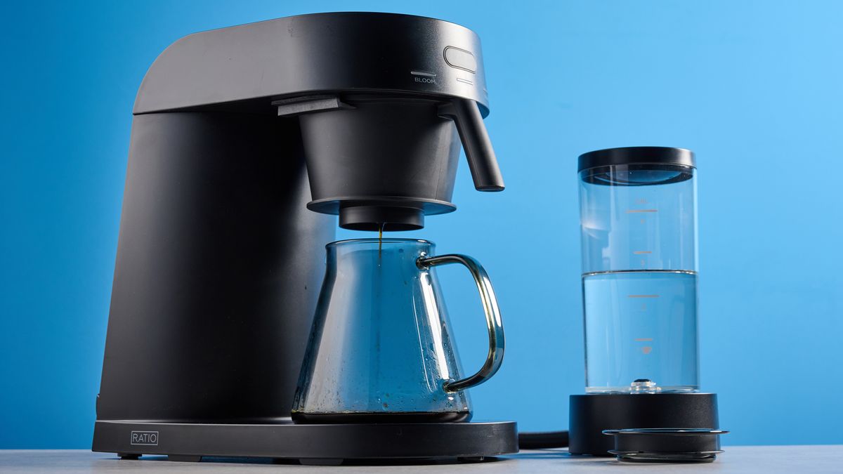 the ratio four coffee maker photographed against a blue tom's guide background