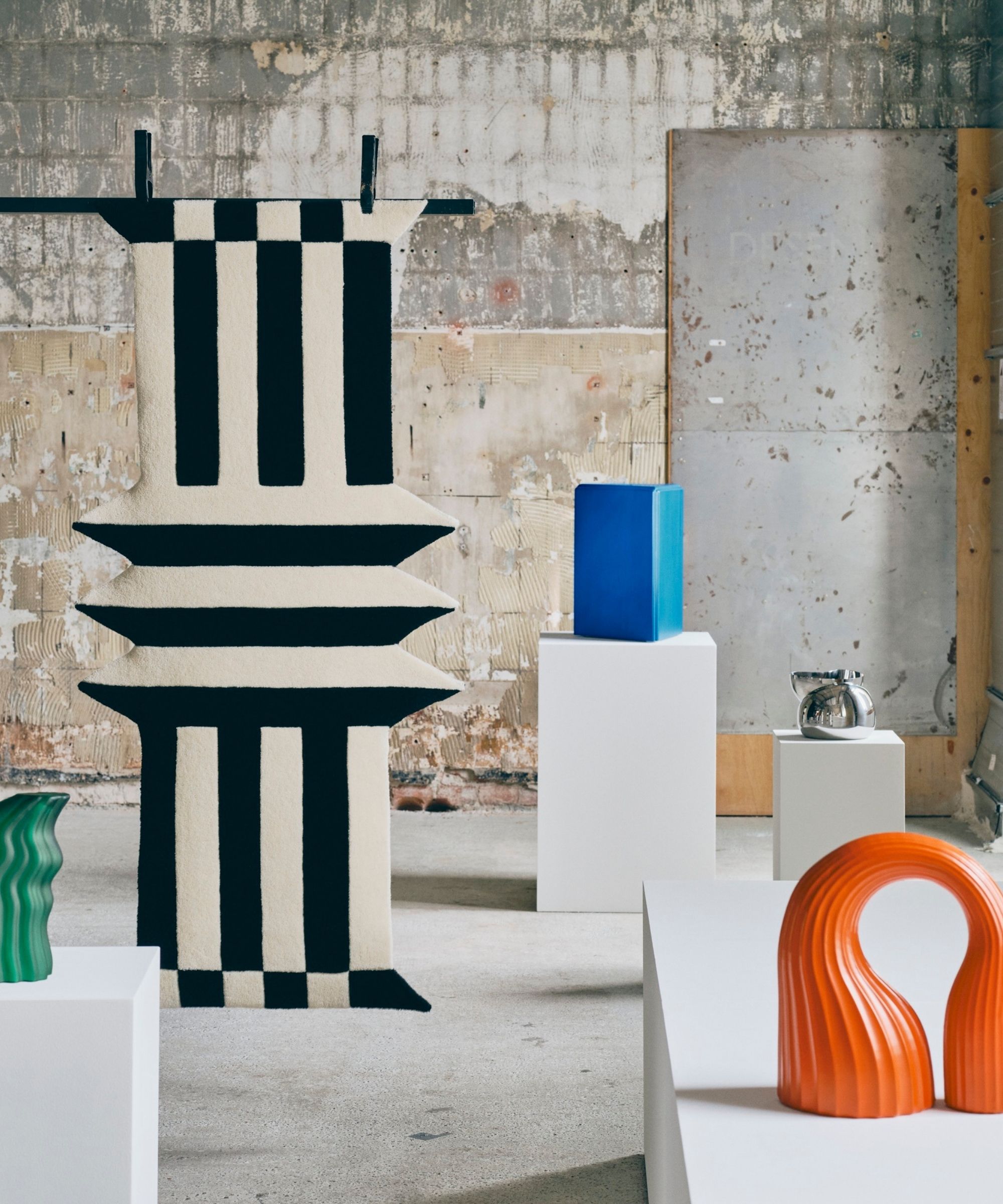 IKEA KONSTRUNDA collection on white plinths in warehouse space