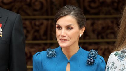 Queen Letizia oozed 1920s glamour as she stepped out in the perfect autumnal look featuring fur and embellished shoulders