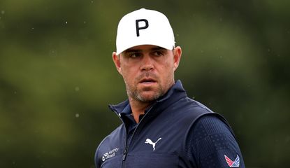 Gary Woodland looks on in the rain at The Open