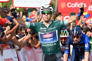 TOPSHOT Team Alpecins Australian rider Kaden Groves celebrates as he crosses the finish line in first place after the fifth stage of the 2023 La Vuelta cycling tour of Spain a 1862 km race from Morella to Burriana on August 30 2023 Photo by JOSE JORDAN AFP Photo by JOSE JORDANAFP via Getty Images