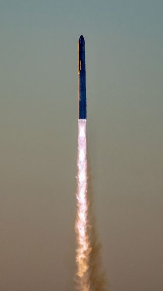 a giant rocket launches against a colorful sky