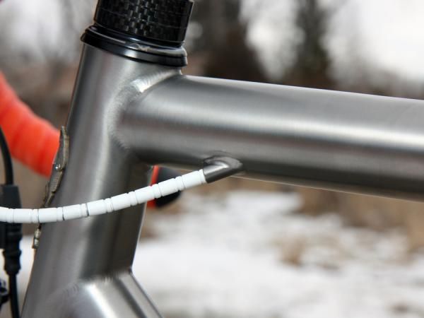 The rear brake cable is run through the top tube.