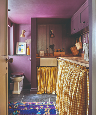 Purple W/C with orange check curtained cabinetry