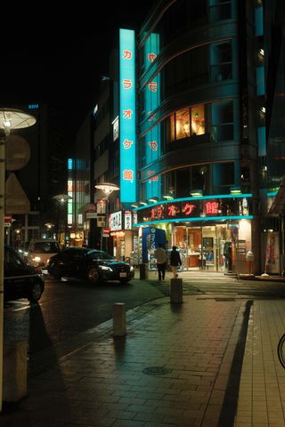 Tokyo street at night with neon signs