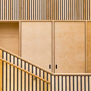 A detail of the main auditorium, showing the staircase and doors made of plywood.