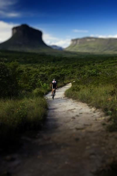 A rider follows the course through an interesting landscape.