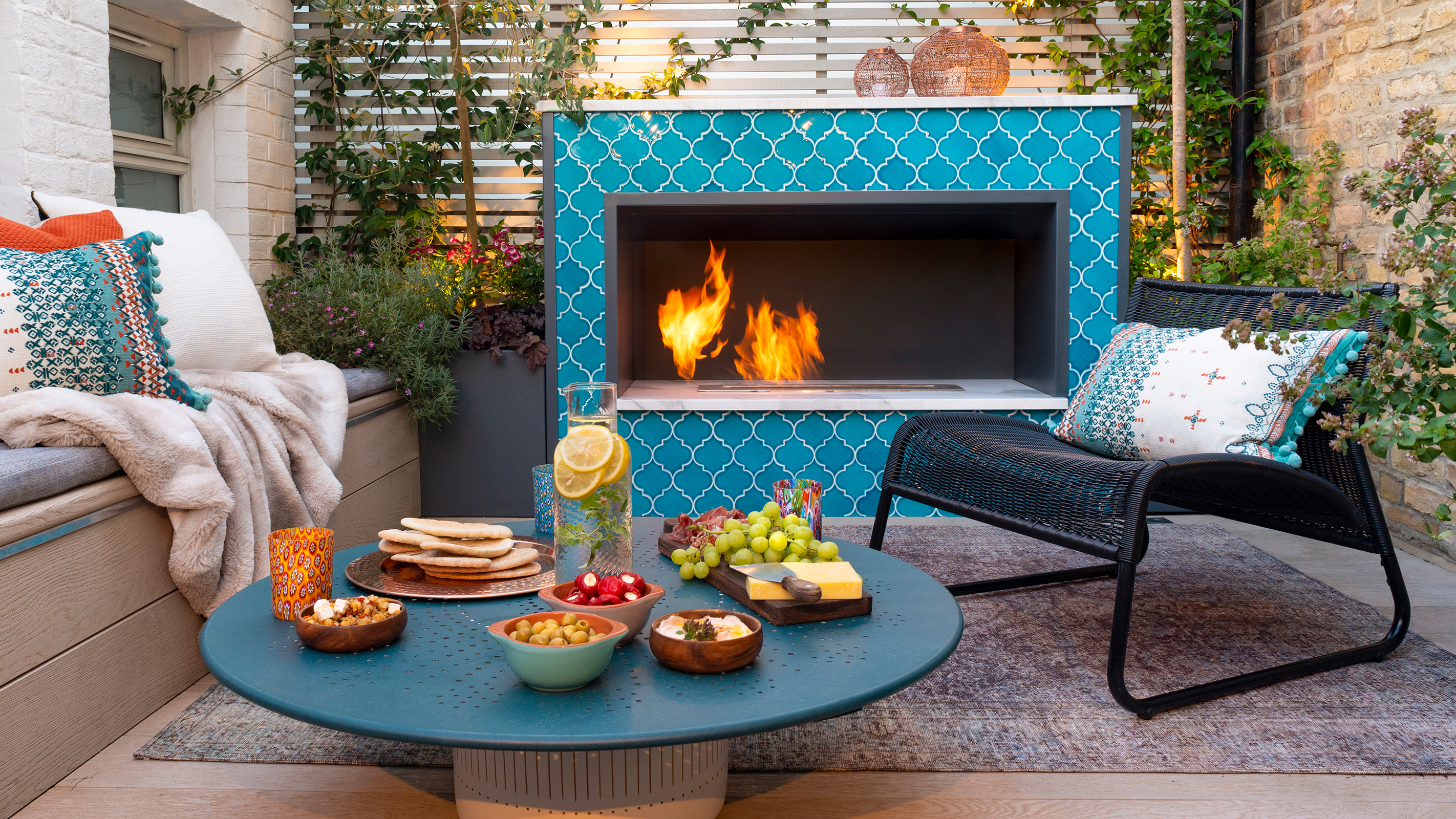 outdoor tiled fireplace in small garden