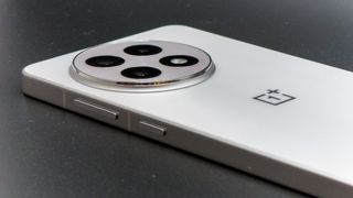 The raised camera island on the back of the white OnePlus 13R