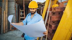 project manager on work site image by getty images