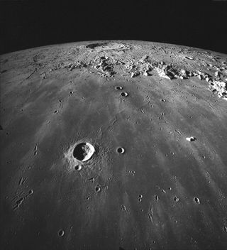 This photograph of the moon, taken by NASA's Apollo 17 astronauts in 1972, shows Mare Imbrium with the 58-mile-wide (93 km) Copernicus in the distance. In the foreground is the crater Pytheas, which is 12 miles (20 km) in diameter.