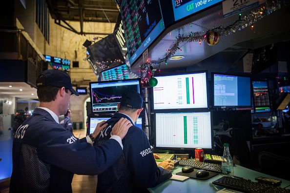 Traders working at the New York Stock Exchange