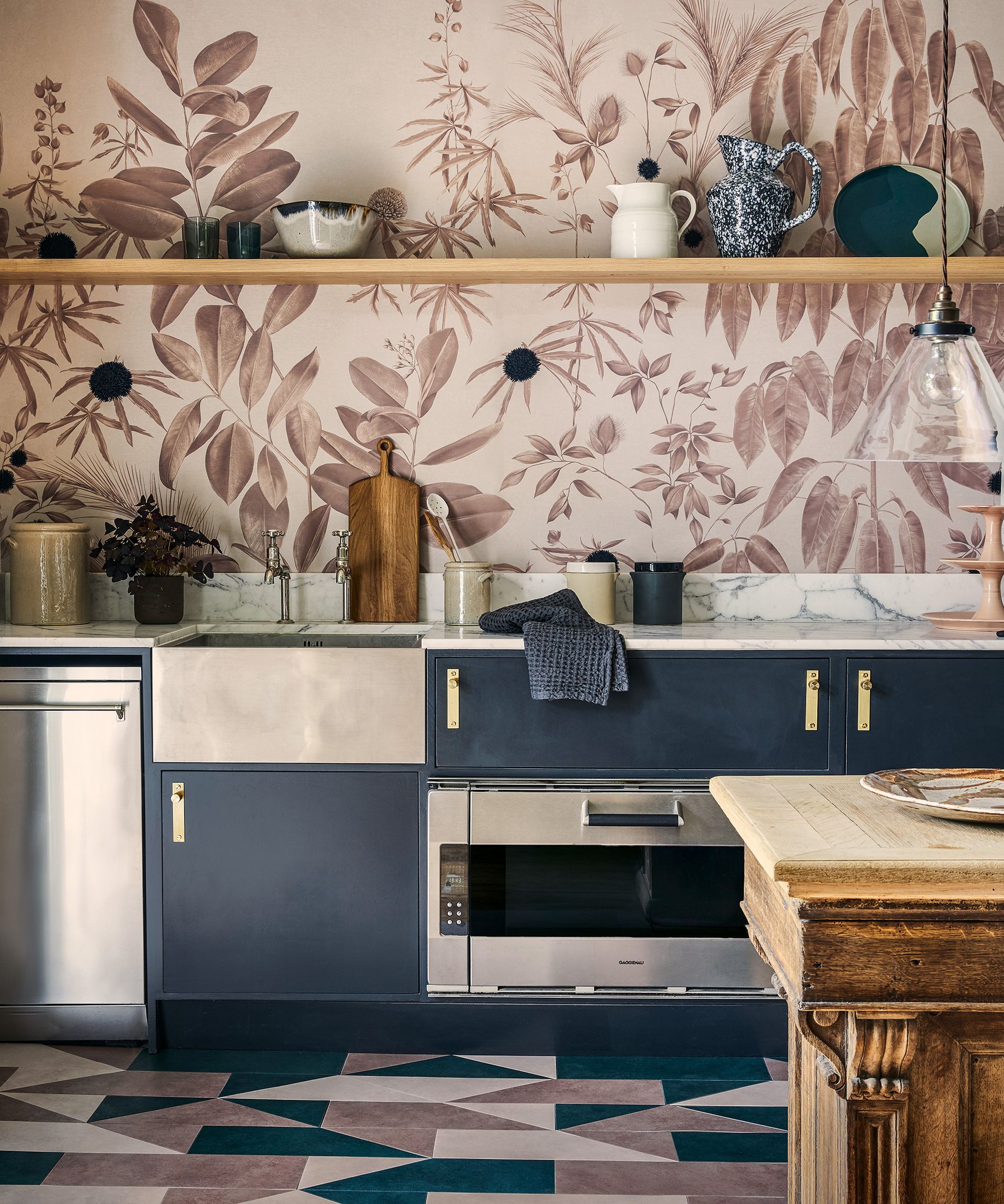 An example of kitchen shelving ideas showing a kitchen with geometric floor tiles and an open shelf above the worktop