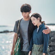 (L to R) Park Bo-gum as Yang Gwan-sik, IU as Oh Ae-sun in When Life Gives You Tangerines