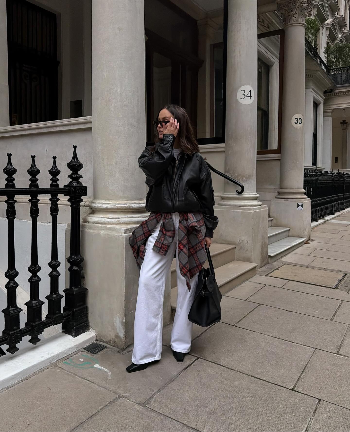 Fashion person Felicity Bird wears London winter shoe trends 2025. She wears square toed boots.