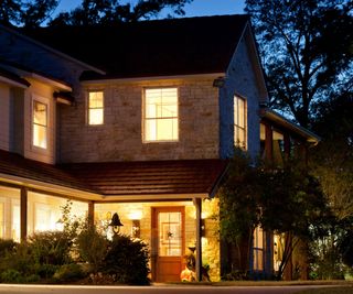 A Texan home lit up at night