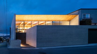 blocky Kyoto house lit from within