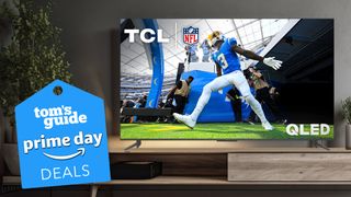 The TCL Q6 displaying an NFL football game in a modern living room setting