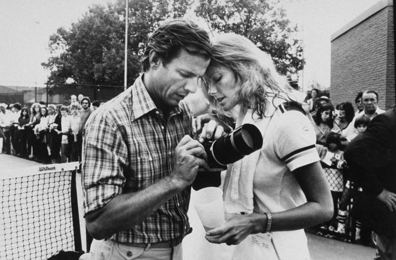 Black and white images of a man and woman with a camera