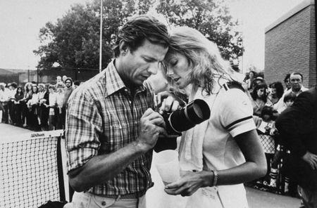 Black and white images of a man and woman with a camera