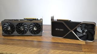 An Asus RTX 4070 Ti next to an Nvidia RTX 4080 Founders Edition on a wooden desk