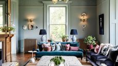 A formal sitting room with pale blue walls