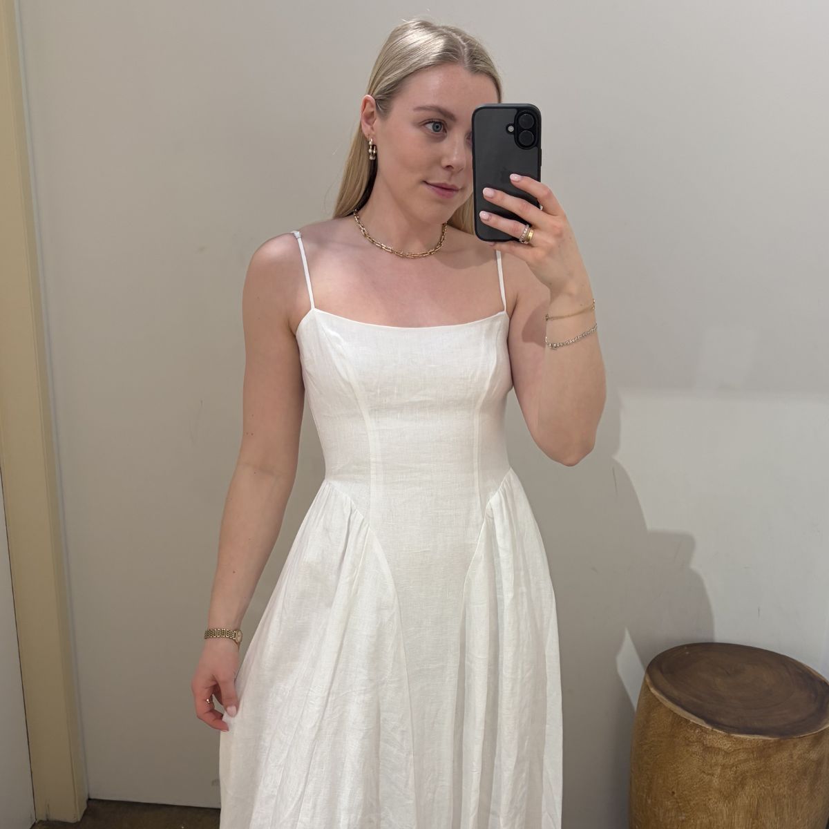 Woman wears white linen dress