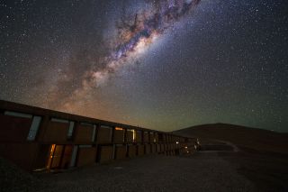 The colorful core of the Milky Way sparkles above the European Southern Observatory's Residencia, a building featured in the James Bond film "Quantum of Solace" that was destroyed in a dramatic explosion (with the help of computer graphics, not real explosives). Residencia houses astronomers and other visitors at the Paranal Observatory in Chile, which is home to the Very Large Telescope Array and several other telescope facilities.